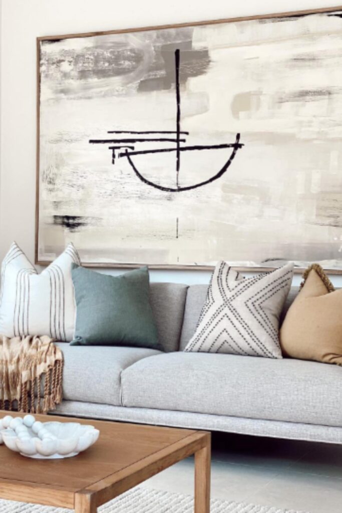 Living room setting with large artwork and sofa