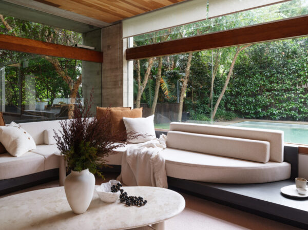 Biophilic interior design 2025 showcasing natural light, indoor plants, sustainable timber furniture, organic shapes and greenery-filled living space promoting wellness and relaxation.